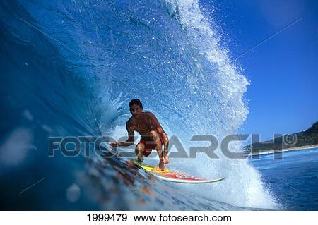 Stock Photo - Hawaii, Oahu, North Shore, Brock Inside Translucent Curling Wave, Close-Up. Fotosearch