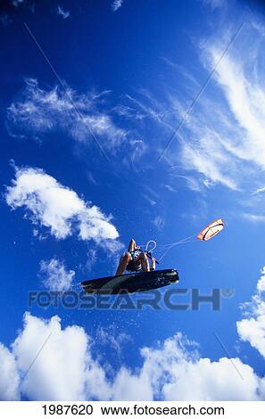 Hawaii, Oahu, North Shore, Mokuleia Beach Park, Airborne Kite Surfer, View From Below. No Model Release View Large Photo Image Stock Image - Hawaii, Oahu, North Shore, Mokuleia Beach Park, Airborne Kite Surfer, View From Below. No Model Release. Fotosearch