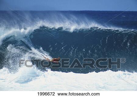 Stock Image - Hawaii, Oahu, North Shore, Pipeline, Mike Stewart World Champion Body Boarder Descends Face Of Wave. Fotosearch