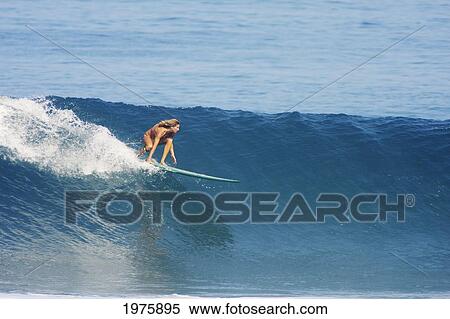 Stock Photography - Hawaii, Oahu, North Shore, Pipeline, Surfer, Riding A Wave.. Fotosearch