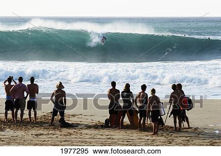 Stock Photography - Hawaii, Oahu, North Shore, Pipeline, Spectators Watch Surfer From Shore.. Fotosearch