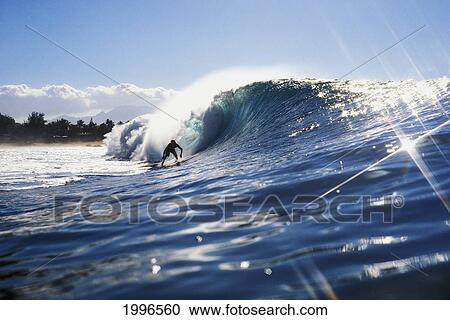 Stock Image - Hawaii, Oahu, North Shore, Shadow Of Distant Surfer Surfing Pipeline Wave.. Fotosearch