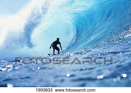 Stock Image - Hawaii, Oahu, North Shore, Silhouette Of Surfer In Pipeline Barrel. Fotosearch