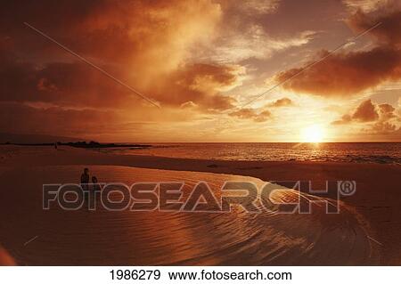 Stock Photo - Hawaii, Oahu, North Shore, Silhouette People Swimming In Beach Tidepool Next To Ocean At Sunset.. Fotosearch