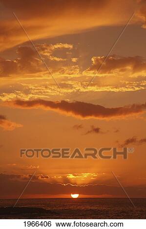 Stock Photograph - Hawaii, Oahu, North Shore, Sunset Over The Ocean.. Fotosearch