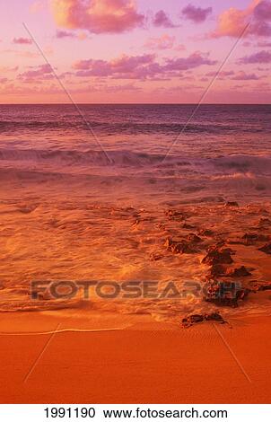 Stock Image - Hawaii, Oahu, North Shore, Sunset. Fotosearch