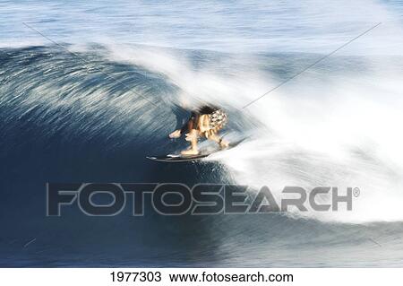 Stock Image - Hawaii, Oahu, North Shore, Surfer, Riding Blur.. Fotosearch