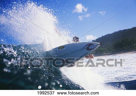 Stock Photo - Hawaii, Oahu, North Shore, Surfer Carves Through A Wave, View Of Surfboard. Fotosearch