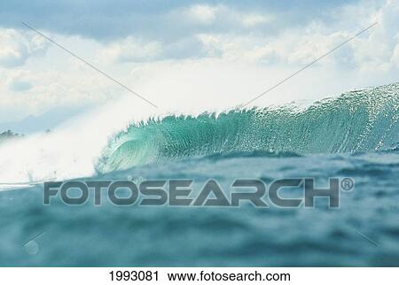 Stock Image - Hawaii, Oahu, North Shore, Turquoise Wave Curls Over At Pipeline.. Fotosearch