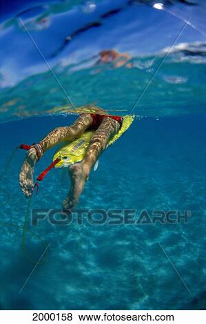 Stock Photo - Hawaii, Oahu, North Shore, Underwater View Surfer Bottom Half Body With Leash On Foot, Turquoise Ocean. Fotosearch