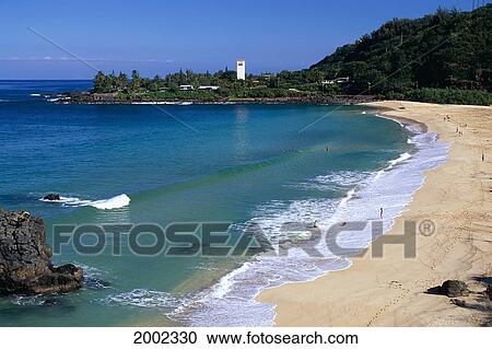 Stock Image - Hawaii, Oahu, North Shore, Waimea Bay State Park View From Above, Lighthouse Background Clear Blue Sky. Fotosearch