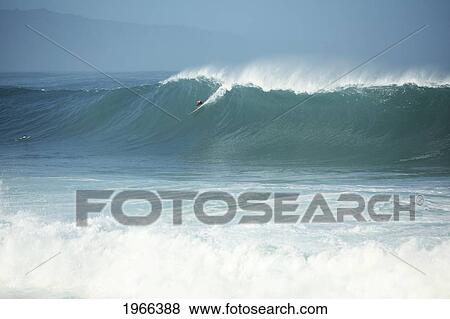 Stock Photo - Hawaii, Oahu, North Shore, Waimea Bay, Surfer On A Huge Wave.. Fotosearch