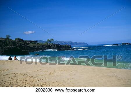 Hawaii, Oahu, North Shore, Waimea Bay Beach Park, Two Bodysurfers Sit And Watch Surf, Blue Sky View Large Photo Image Stock Photo - Hawaii, Oahu, North Shore, Waimea Bay Beach Park, Two Bodysurfers Sit And Watch Surf, Blue Sky. Fotosearch