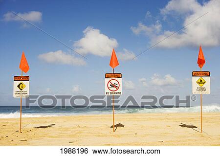 Stock Photograph - Hawaii, Oahu, North Shore, Warning Signs Posted On The Beach. Fotosearch