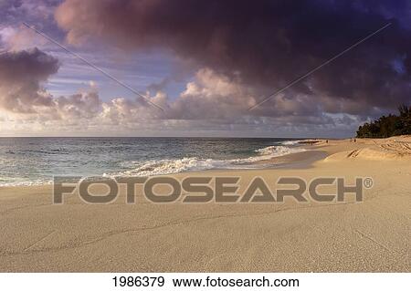 Stock Photo - Hawaii, Oahu, North Shore, Water Lapping Onto Shore Of A Beautiful Sandy Beach.. Fotosearch