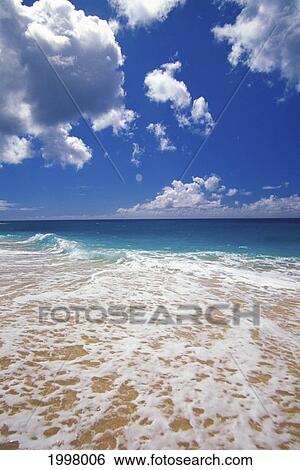 Stock Photograph - Hawaii, Oahu, North Shore, White Wash On Sand Turquoise Water Blue Sky Puffy Clouds. Fotosearch