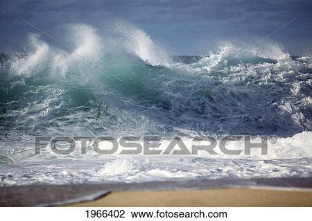 Stock Image - Hawaii, Oahu, Ocean Wave Breaking On Shore.. Fotosearch