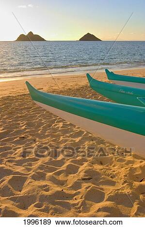 Stock Photo - Hawaii, Oahu, Outrigger Canoes On Lanikai Beach At Sunrise. Fotosearch