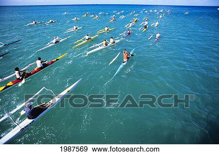 Hawaii, Oahu, Paddlers Race One And Two-Man Outrigger Canoes In Open Ocean. No Model Release View Large Photo Image Stock Photo - Hawaii, Oahu, Paddlers Race One And Two-Man Outrigger Canoes In Open Ocean. No Model Release. Fotosearch