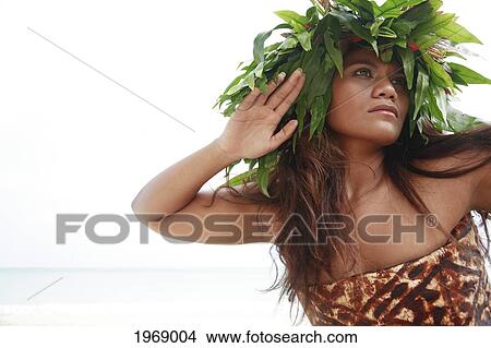 Picture - Hawaii, Oahu, Polynesian Female Posing Wearing Wild Fern Haku And Tapa Cloth. Fotosearch