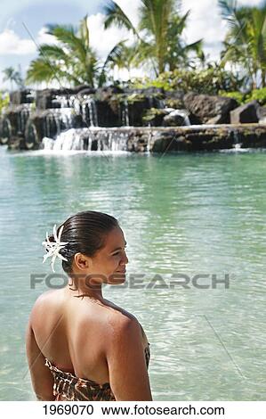 Hawaii, Oahu, Polynesian Female Relaxing And Smiling In A Beautiful Waterfall Pool View Large Photo Image Stock Image - Hawaii, Oahu, Polynesian Female Relaxing And Smiling In A Beautiful Waterfall Pool. Fotosearch