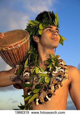 Hawaii, Oahu, Polynesian Man With Drum Along Coast, Sunrise Light. View Large Photo Image Stock Photo - Hawaii, Oahu, Polynesian Man With Drum Along Coast, Sunrise Light.. Fotosearch