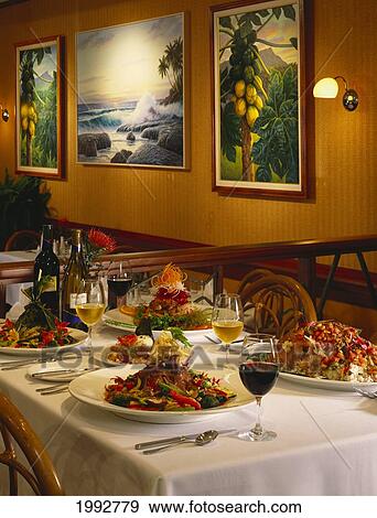 Hawaii, Oahu, Sam Choy's Diamond Head Restaurant Interior, Table Set Up With Wine And Dinner Entrees, Appetizers View Large Photo Image Stock Photo - Hawaii, Oahu, Sam Choy's Diamond Head Restaurant Interior, Table Set Up With Wine And Dinner Entrees, Appetizers. Fotosearch