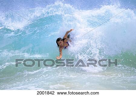 Hawaii, Oahu, Sandy Beach, Woman Bodysurfs In Turbulent Turquoise Ocean View Large Photo Image Stock Image - Hawaii, Oahu, Sandy Beach, Woman Bodysurfs In Turbulent Turquoise Ocean. Fotosearch