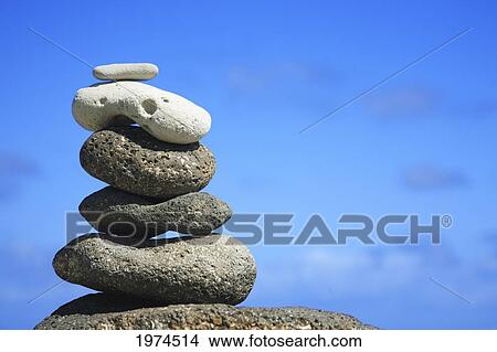 Picture - Hawaii, Oahu, Spa Element Of Rocks Stacked Up Against A Blue Sky.. Fotosearch