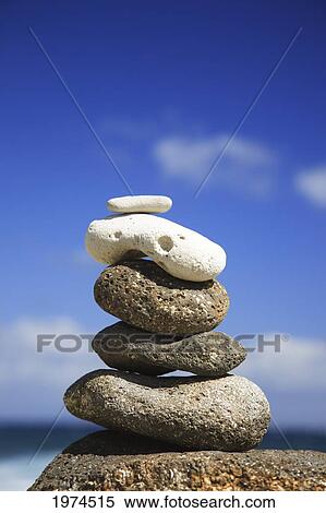 Stock Photography - Hawaii, Oahu, Spa Element Of Rocks Stacked Up Against A Blue Sky.. Fotosearch