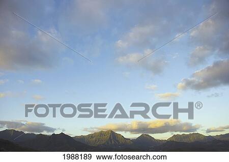 Stock Photo - Hawaii, Oahu, Sunrise Over The Koolau Mountains. Fotosearch