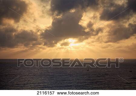 Stock Photo - Hawaii, Oahu, Sunset over Waikiki Beach and ocean.. Fotosearch
