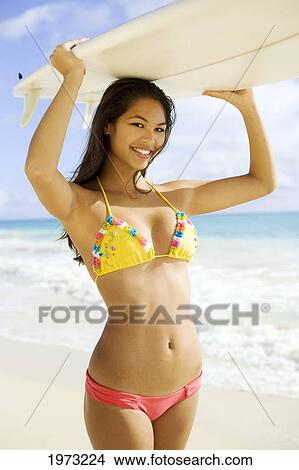 Picture - Hawaii, Oahu, Surfer Girl Enjoying A Day Out.. Fotosearch