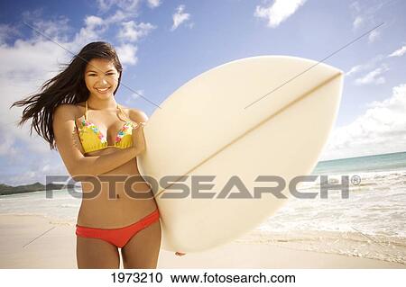 Stock Image - Hawaii, Oahu, Surfer Girl Enjoying A Day Out.. Fotosearch