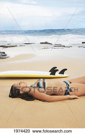 Stock Image - Hawaii, Oahu, Surfer Girl Enjoying A Day Out.. Fotosearch