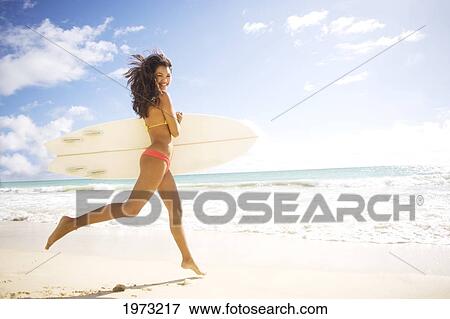 Hawaii, Oahu, Surfer Girl Enjoying A Day Out. View Large Photo Image Stock Photo - Hawaii, Oahu, Surfer Girl Enjoying A Day Out.. Fotosearch