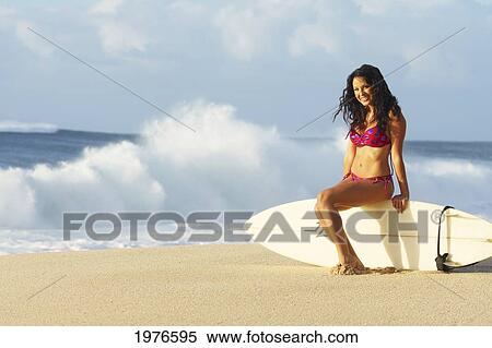 Stock Photography - Hawaii, Oahu, Surfer Girl On Beach In Swimsuit With Surfboard.. Fotosearch