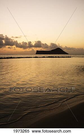 Stock Photography - Hawaii, Oahu, View From Makapu'u, Rabbit Island, Dramatic Sky At Sunset.. Fotosearch