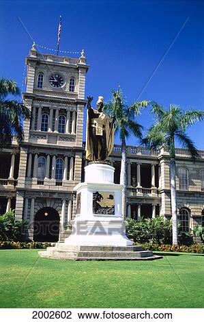 Stock Image - Hawaii, Oahu, View Of King Kamehameha Statue, Green Grass, Blue Sky. Fotosearch
