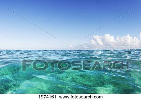 Hawaii, Oahu, View Of Tranquil Ocean With Blue Water. View Large Photo Image Stock Image - Hawaii, Oahu, View Of Tranquil Ocean With Blue Water.. Fotosearch