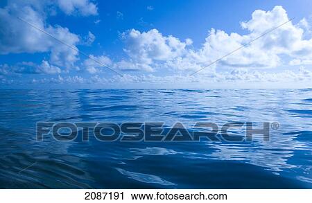 Stock Image - Hawaii, Oahu, View of tranquil ocean with blue water. Fotosearch