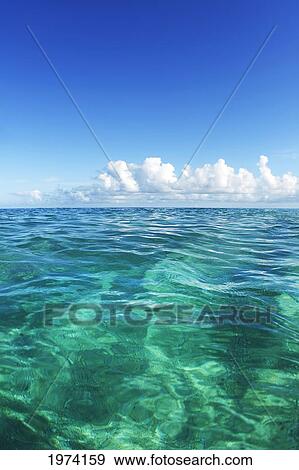 Hawaii, Oahu, View Of Tranquil Ocean With Blue Water. View Large Photo Image Stock Photo - Hawaii, Oahu, View Of Tranquil Ocean With Blue Water.. Fotosearch