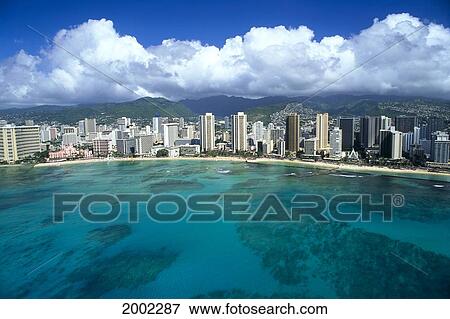 Stock Photo - Hawaii, Oahu, Waikiki, Aerial View From Ocean Looking Toward Mountains. Fotosearch