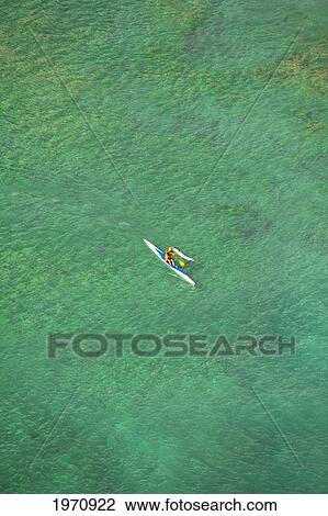 Hawaii, Oahu, Waikiki, Aerial View Of Local Man In An Outrigger Canoe. (Editorial Use Only) View Large Photo Image Stock Image - Hawaii, Oahu, Waikiki, Aerial View Of Local Man In An Outrigger Canoe. (Editorial Use Only). Fotosearch