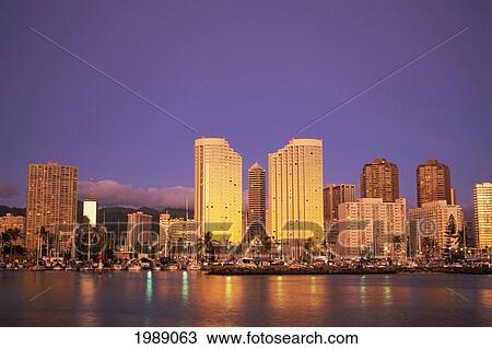 Stock Image - Hawaii, Oahu, Waikiki, Ala Moana Skyline At Twilight.. Fotosearch