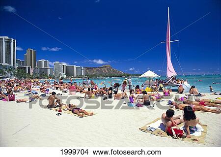 Hawaii, Oahu, Waikiki Beach Crowded With Visitors Sunbathing, Diamond Head Background, Blue Sky View Large Photo Image Picture - Hawaii, Oahu, Waikiki Beach Crowded With Visitors Sunbathing, Diamond Head Background, Blue Sky. Fotosearch