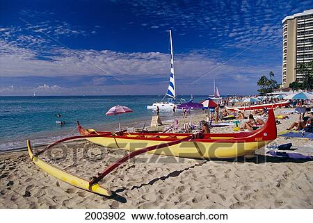 Hawaii, Oahu, Waikiki Beach With Yellow And Red Outrigger Canoe On Shore, Catamaran Visitors Enjoying Sun View Large Photo Image Stock Image - Hawaii, Oahu, Waikiki Beach With Yellow And Red Outrigger Canoe On Shore, Catamaran Visitors Enjoying Sun. Fotosearch