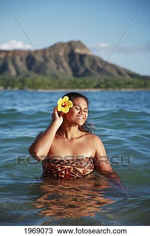 Hawaii, Oahu, Waikiki, Beautiful Local Polynesian Female In The Water Enjoying A Sunny Day With Diamond Head In Background View Large Photo Image Stock Image - Hawaii, Oahu, Waikiki, Beautiful Local Polynesian Female In The Water Enjoying A Sunny Day With Diamond Head In Background. Fotosearch