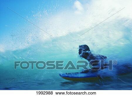 Stock Photo - Hawaii, Oahu, Waikiki, Boogieboarder Riding Inside Wave.. Fotosearch
