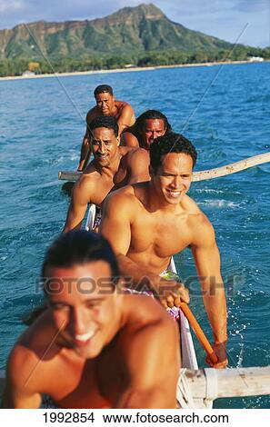 Hawaii, Oahu, Waikiki, Close-Up Of Paddlers In An Outrigger, On Ocean, Diamond Head In Background View Large Photo Image Picture - Hawaii, Oahu, Waikiki, Close-Up Of Paddlers In An Outrigger, On Ocean, Diamond Head In Background. Fotosearch